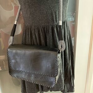 Custom designed purse made in South Africa of recycled tires with fabric lining